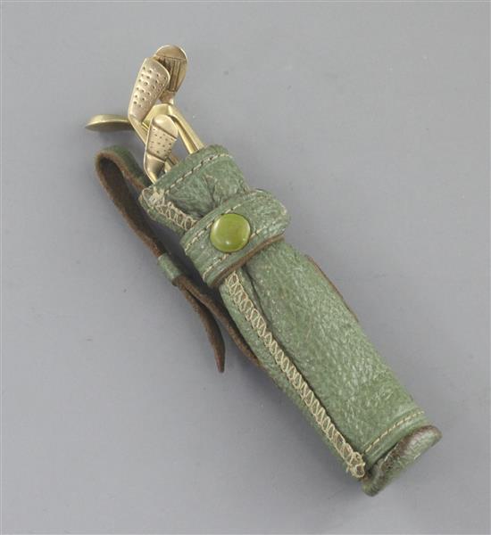 An early 20th century novelty 9ct gold mounted steel five piece manicure set modelled as a set of golf clubs in a leather golf bag,